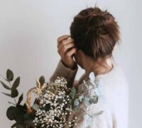 Woman Tucking Her Hair Behind Her Ear