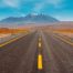 Long Open Road with Mountains in the Background