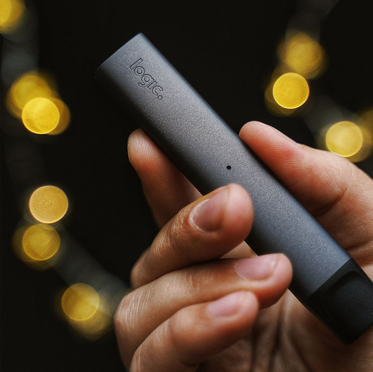 Person Holding a Black Vape